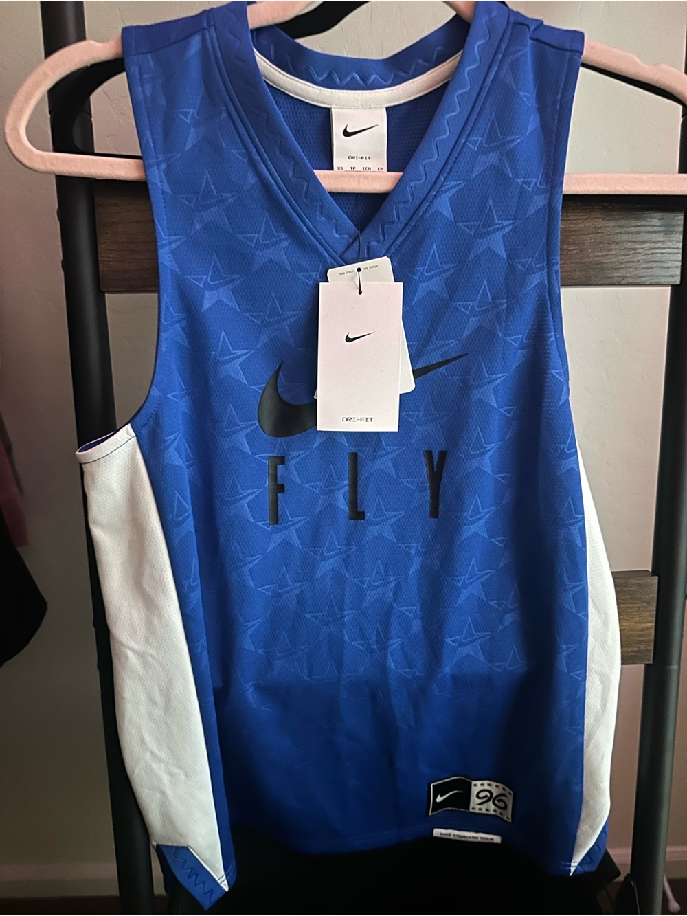 blue Nike Dri-FIT Fly Standard Issue women's basketball jersey with white side